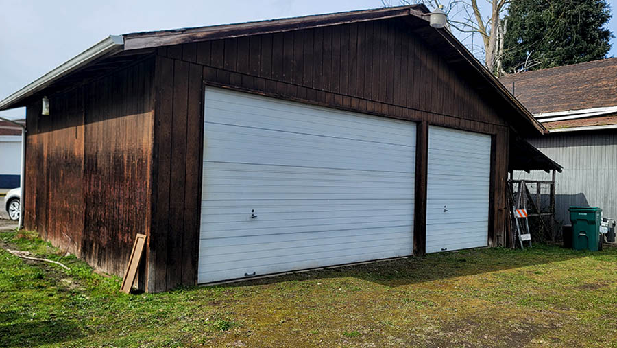 Three-bay detached garage with two high-clearance roll-up doors