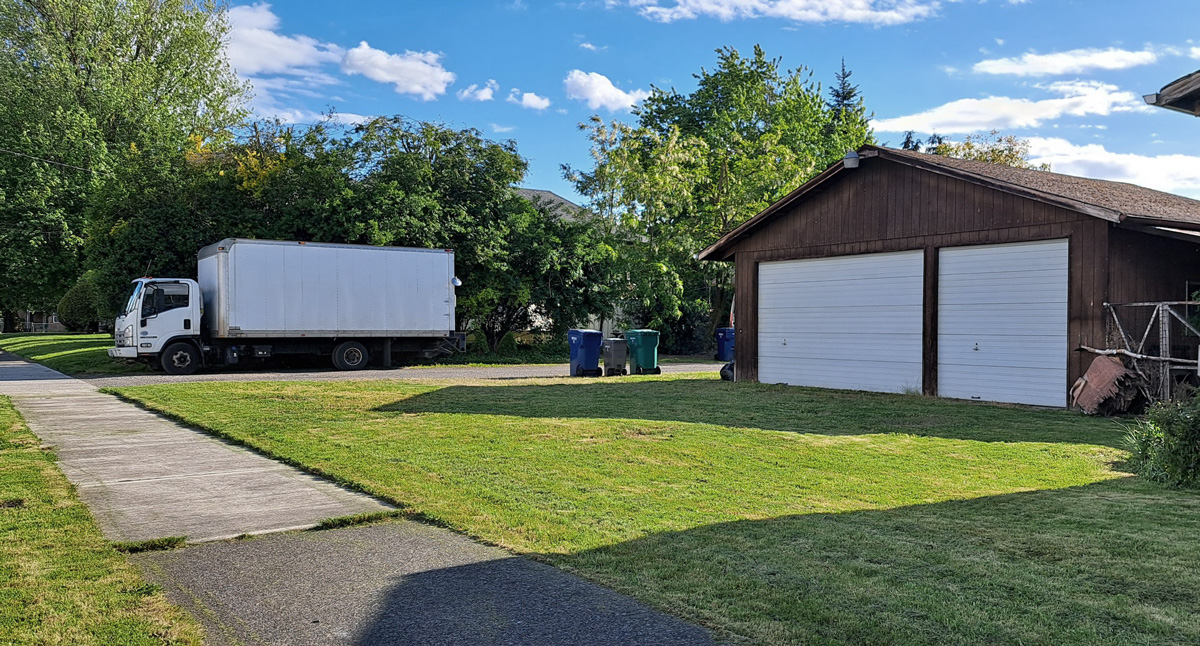 Garage with delivery truck showing vehicle access